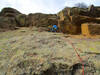 Nate A. contemplating the crux on pitch 3.