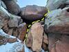 The final chockstone constriction if taking the gully to the top. The right side went at M5. I found small nuts and a 0.2 to protect the crux moves. You may want to belay right after turning the lip to avoid the rope eating constriction.