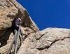 Mari comfortably belaying from the chains at the top of P1.