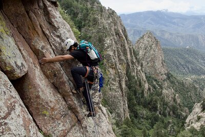 Giacomo looking poised before the P2 roof. (Sweet views of Hail Peak too!)