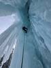Climbing through a hole in the cave!