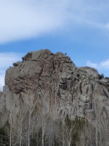 Looking across the west face of window while walking to the parking lot.  Unknown climber at top of unknown route center shot.  Maybe Battle of the Bulges?  4/19/24