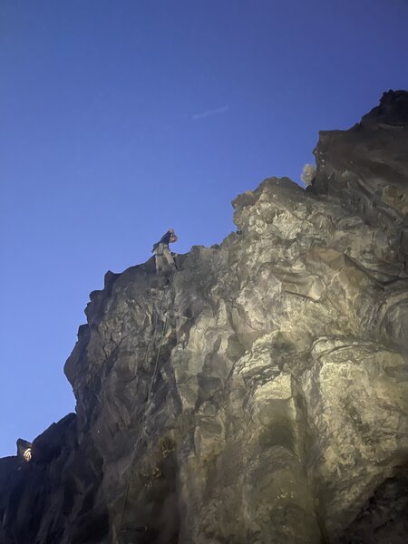 Climber at the anchors of 11 O'Clock, at 10 O'Clock