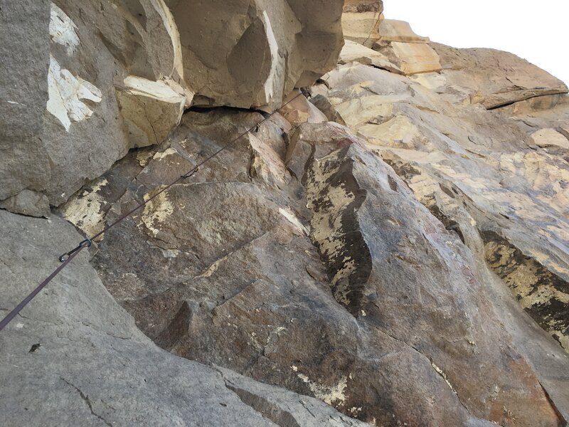 The roof traverse on the last pitch.