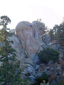 Climber on Mardi Gras (5.10b), Holcomb Valley Pinnacles