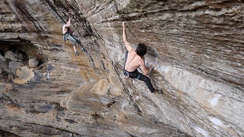 Pulling the crux to get onto the headwall of pushing up daisies