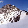 Pacific's summit from halfway up the north ridge. The North Couloir route ends in the notch between the two summits. May 22, 2004.