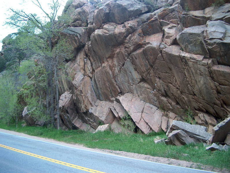 Deer Creek Crag seen from the road: Horseshoes and Handgrenades hidden behind the tree; Variety Show is the dihedral near the middle; The Pump and the Pendulum is the chalked climb on the right. 