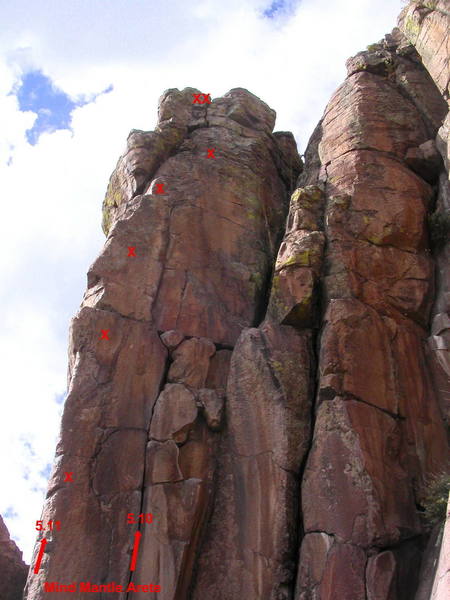Mind Mantle Arete.  The 5.10 variation starts in the crack to the right, then moves left to the arete at the third bolt.  The 5.11 variation takes the arete from the bottom.