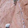 Jon keenly watches Ely as he climbs Anaconda.