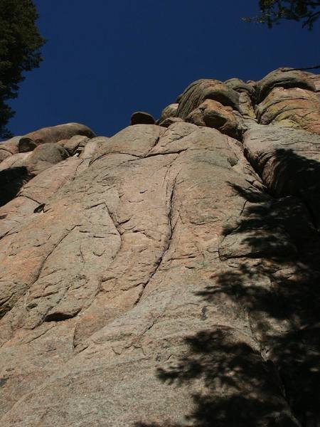 The route follows the prominant crack in the center of the photo, then face climbs up and left to the handcrack.