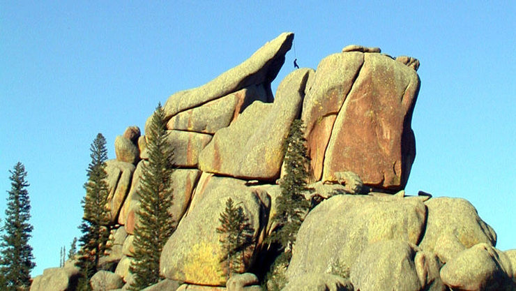 Unknown climber rapping off the backside of the Parabolic Slab (5.2?) on the Nautilus.