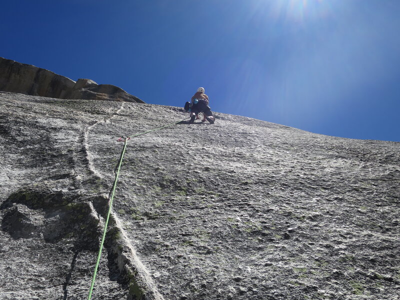 Beta for P4: After clipping the bolt visible from the P3 belay, do not follow the dike or you'll miss the next bolt. Instead, head somewhat right and then up over the bulge. The bolt is above the bulge.