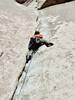 Climbing through the crux section of Pope's Crack. Place gear at the hip so you don't block the good jams!