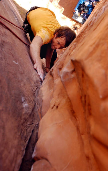 Jason Jones reaches for a hand jam on top rope near the crux of Lacto Mangulation -  5.10b.