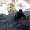 Irvin Fernandez approaches first pitch belay on Overhang Bypass.  (C)2002 Mike Morley.