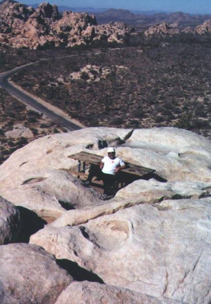 A climbing buddy ready for a picnic atop Intersection Rock (prolly winter '00).