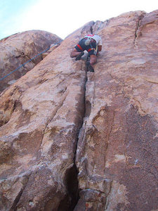 seemed much harder than a 5.7.  Closer to a 5.8 or slightly more.  Decent route with lots of balence, hand jams, and lie backs.  This is my friend Mike working his way up the crack.  
