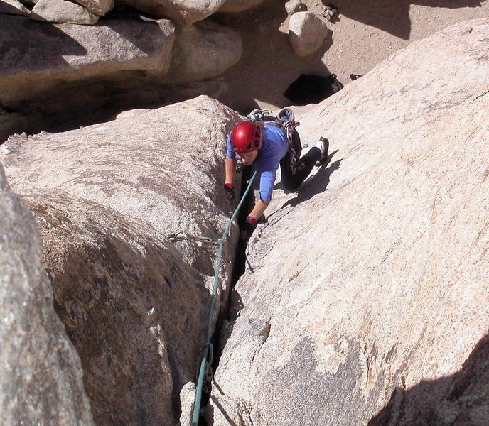 Christa Cline jamming the final moves to the top.