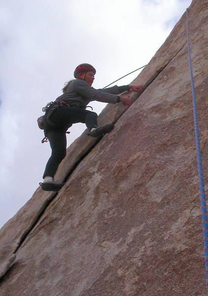 Christa Cline laybacking the top of the flake before stepping left onto the face.