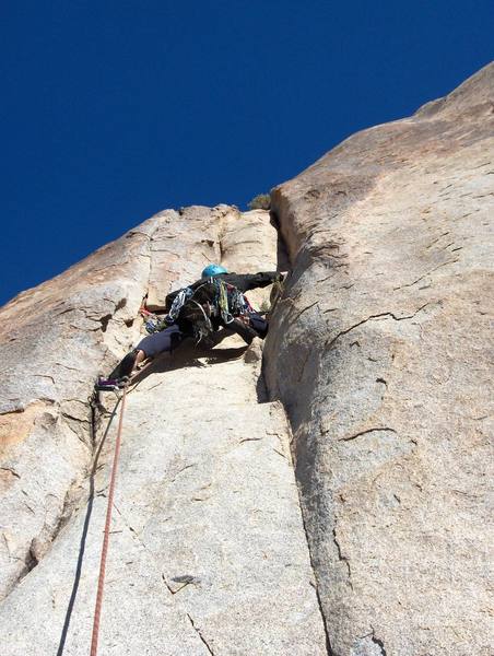 Chris has gear at his feet.  This was the first good opportunity for gear after stepping off from the bolted belay.  It was a bit commiting getting to that spot.