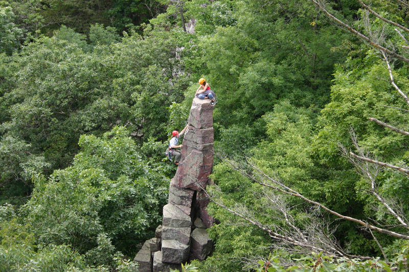 Photo by Mike Pyle of Amos Patrick climbing up to Molly Patrick on Cleo's Needle