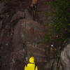 Dan F starting the lead of Sometimes crack 5.10a in the middle of the rain. Photo Mike Lopera 