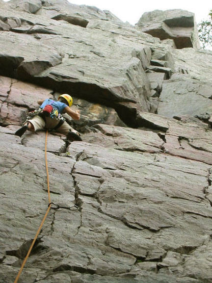 Tricia King placing pro just before the crux on Lost Face 5.6. Photo Mike Lopera.