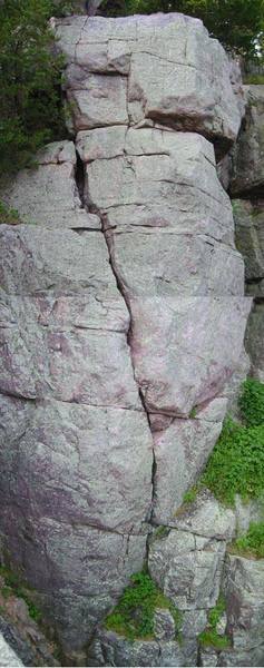 Jack of Spades (5.6) goes up the diagonal crack and just to the right of the corner