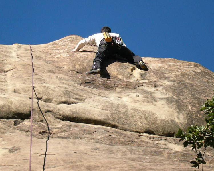 Risley just above crux at the only bolt on climb.