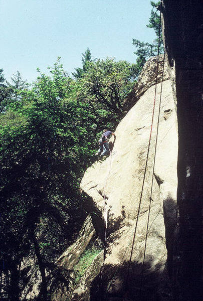 David Caunt climbing the final arete on the FA of "The Anti-Christ" (5.11d) in the spring of 1991.