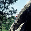 Over the roof on the final summit slab of "Putrefaction" (5.11a), Castle Rock Waterfall Cliff, CRSP, California