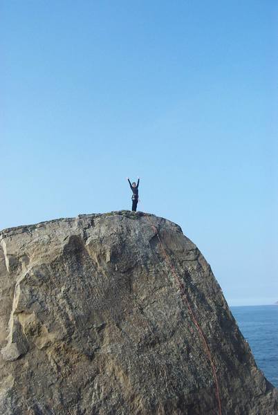 Sallie celebrating after topping out.  A great view from up here!