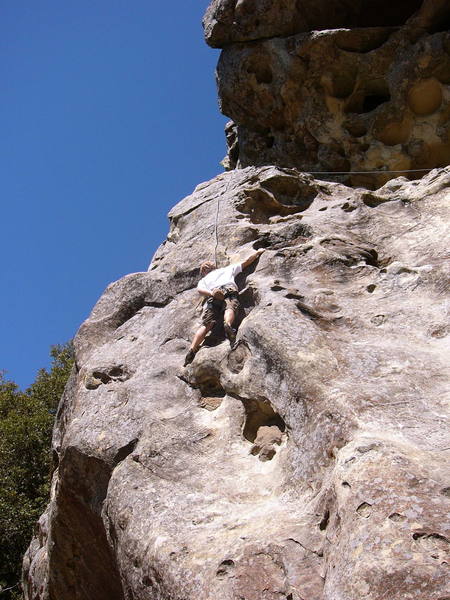 Brad past the second overhang getting to easier ground.