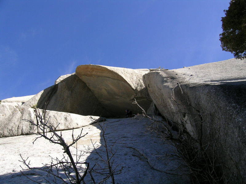 Just above the chimney (seen on the right partially hidden by the bush) on the 4th pitch as I begin the traverse under the roof.